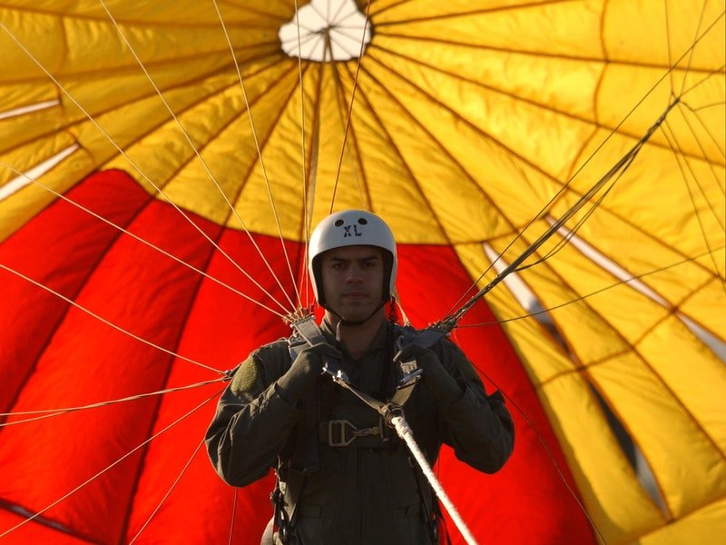 man wearing skydiving gear