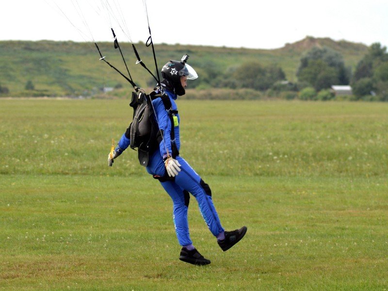 A skydiver landing in ground