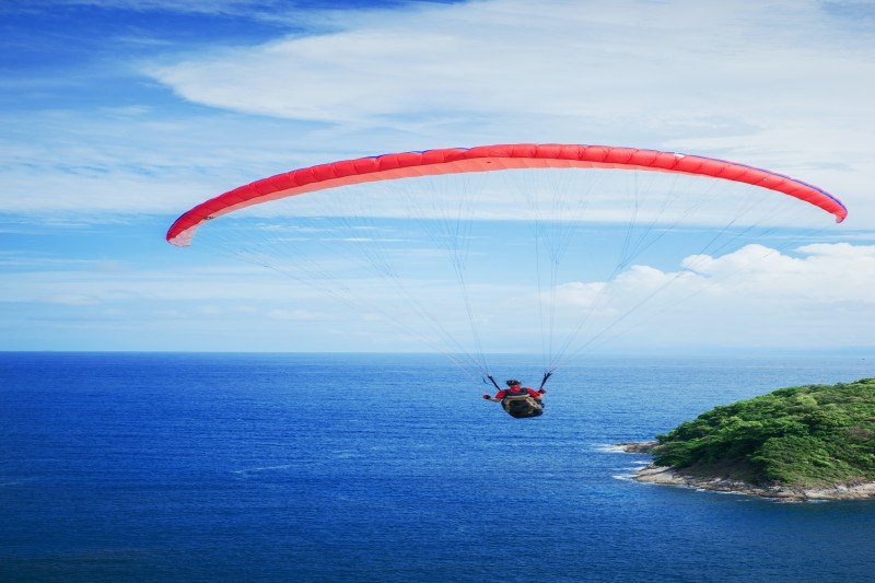 Base jumper gliding on a parachute