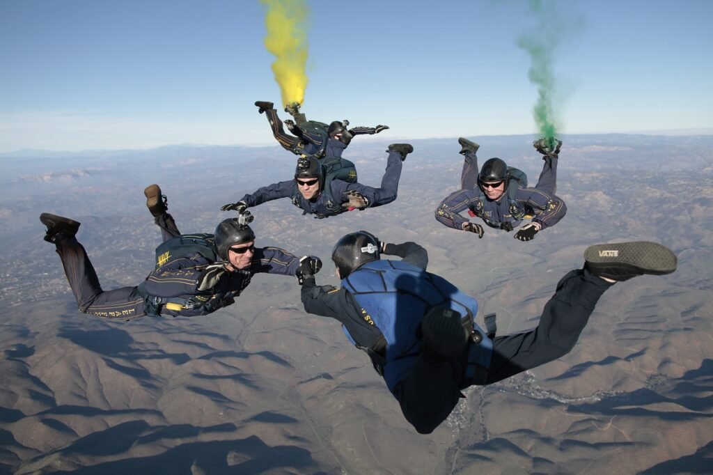A tandem skydiving team in freefall with a clear blue sky in the background, representing weight considerations for a safe skydiving experience.