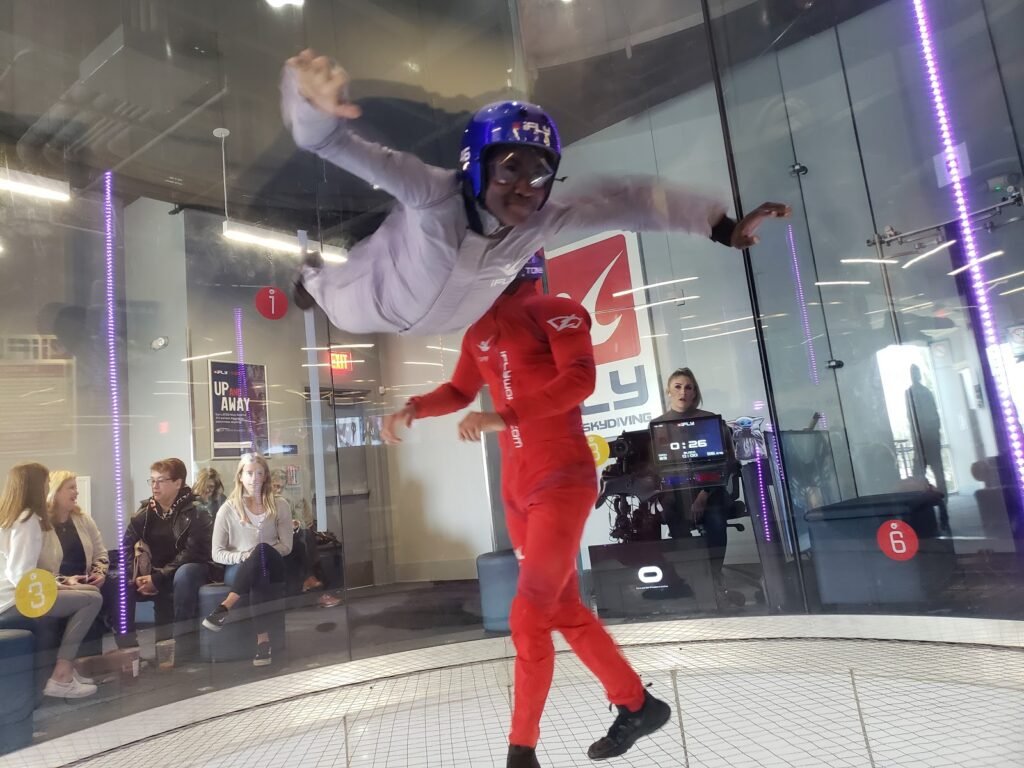 Safety demonstration by iFLY instructor at indoor skydiving facility